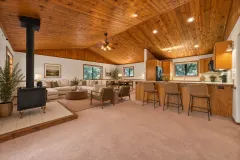 2332 Alpen Court — Open living, dining and kitchen spaces beneath wood ceilings