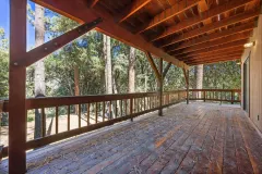 2332 Alpen Court — Covered deck and railing overlooking the trees