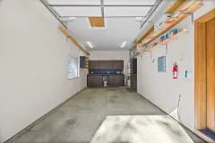 2332 Alpen Court — Garage interior with storage and workbench