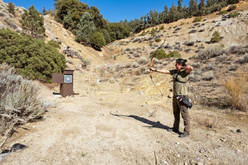 Archer practicing at Pine Mountain Club archery range in the mountains