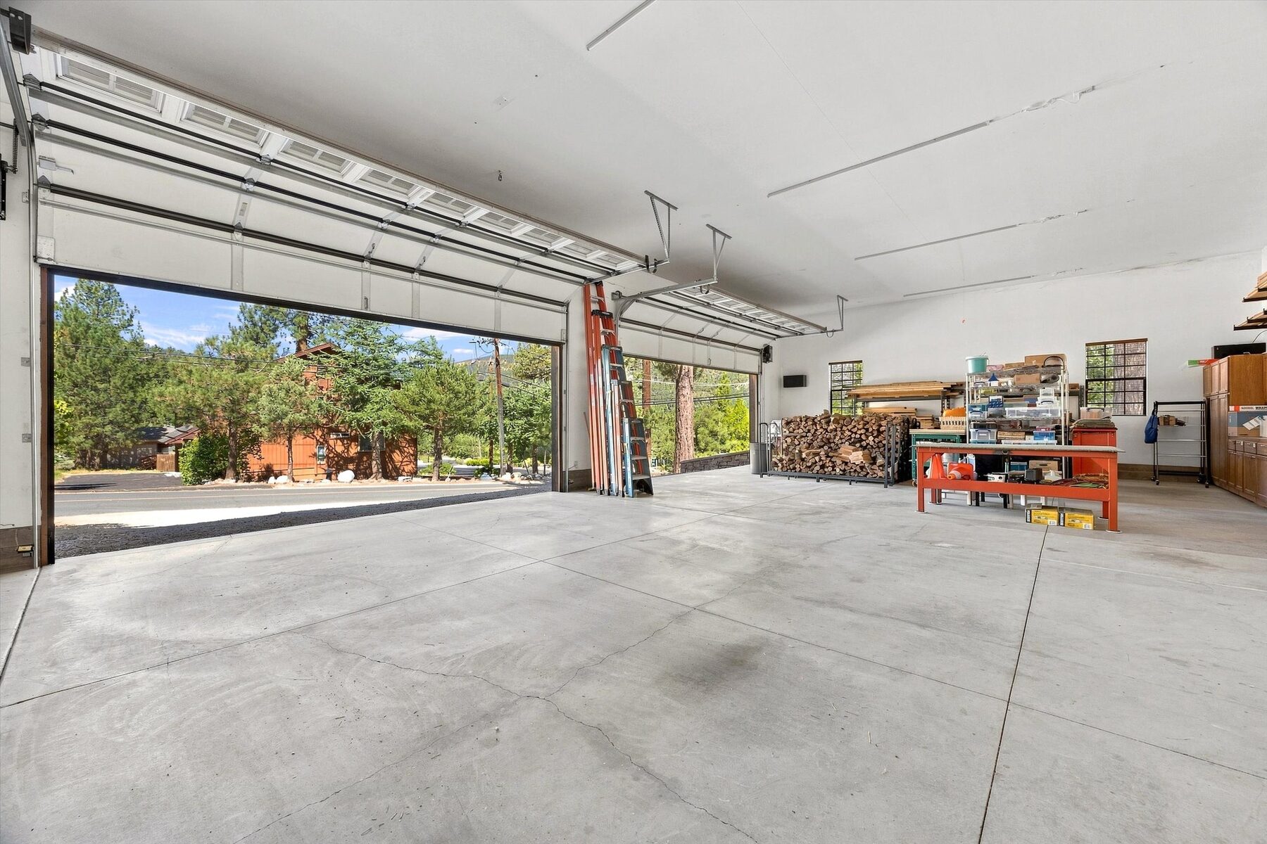 16330 Askin Drive — oversized garage interior with workshop space and open doors
