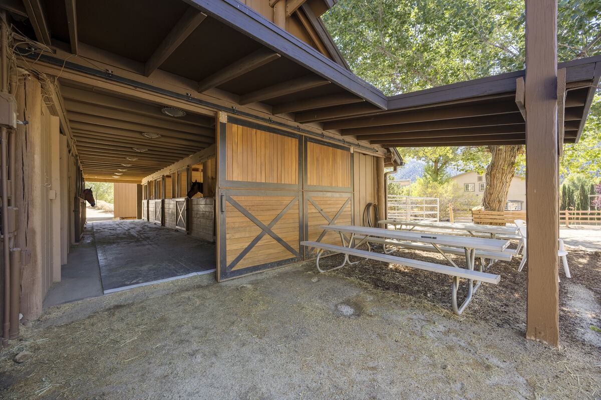 PMC Equestrian Center barn exterior with covered picnic area