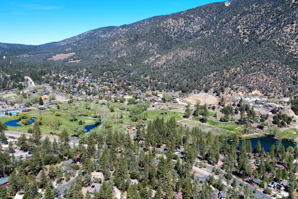 Pine Mountain Club summer aerial showing green golf course and village