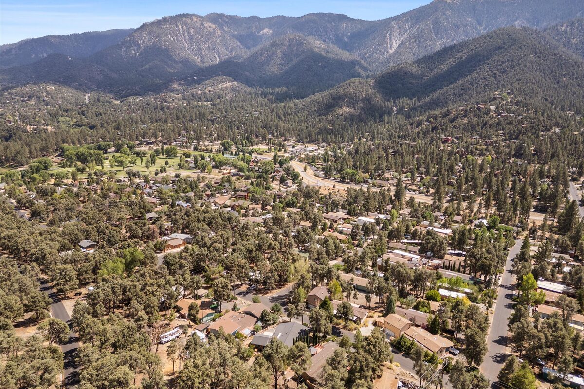Pine Mountain Club community aerial view in summer with mountains