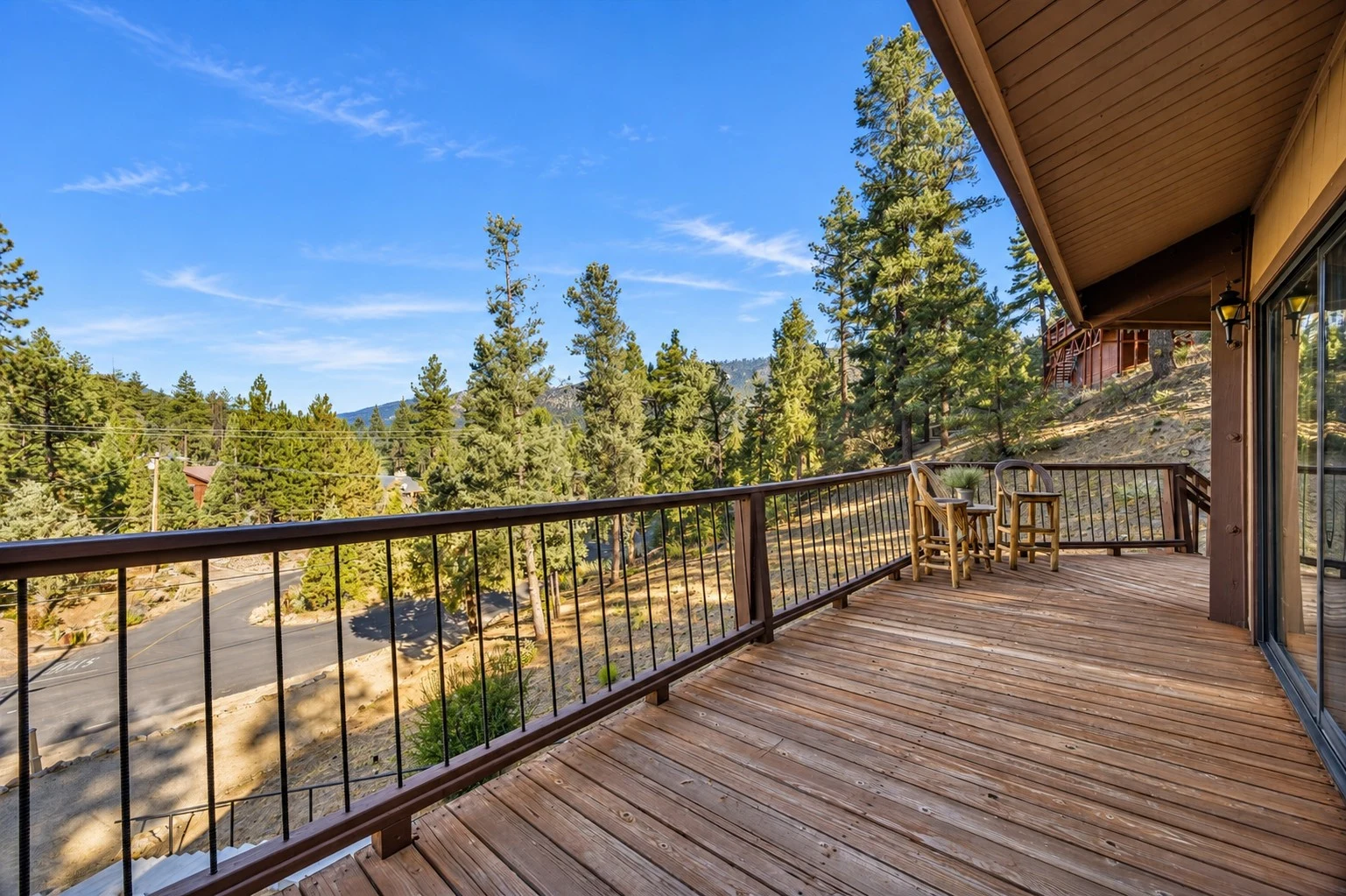 2104 Ironwood Drive — Spacious wooden deck along the home with mountain views