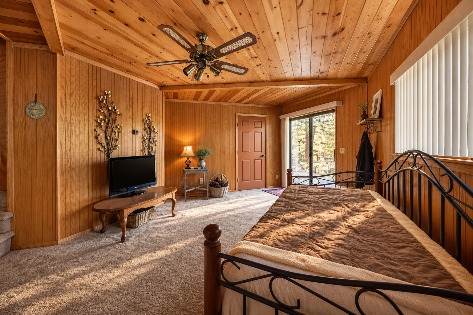 2104 Ironwood Drive — Lower-level den with sliding glass entry and spiral staircase