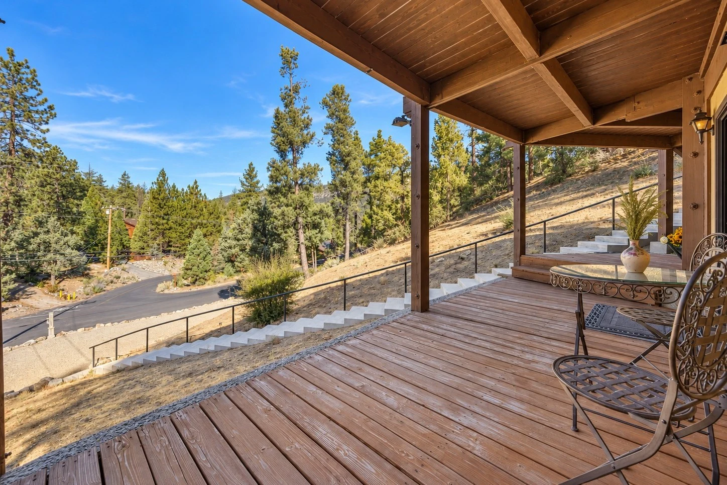 2104 Ironwood Drive — Covered lower-level porch with mountain and forest views