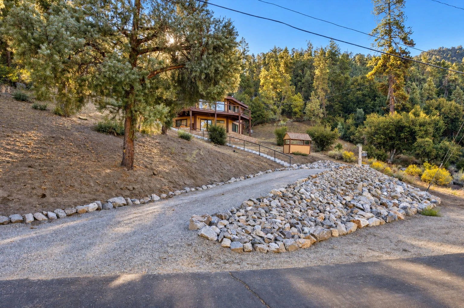 2104 Ironwood Drive — Gravel driveway and landscaped rock border