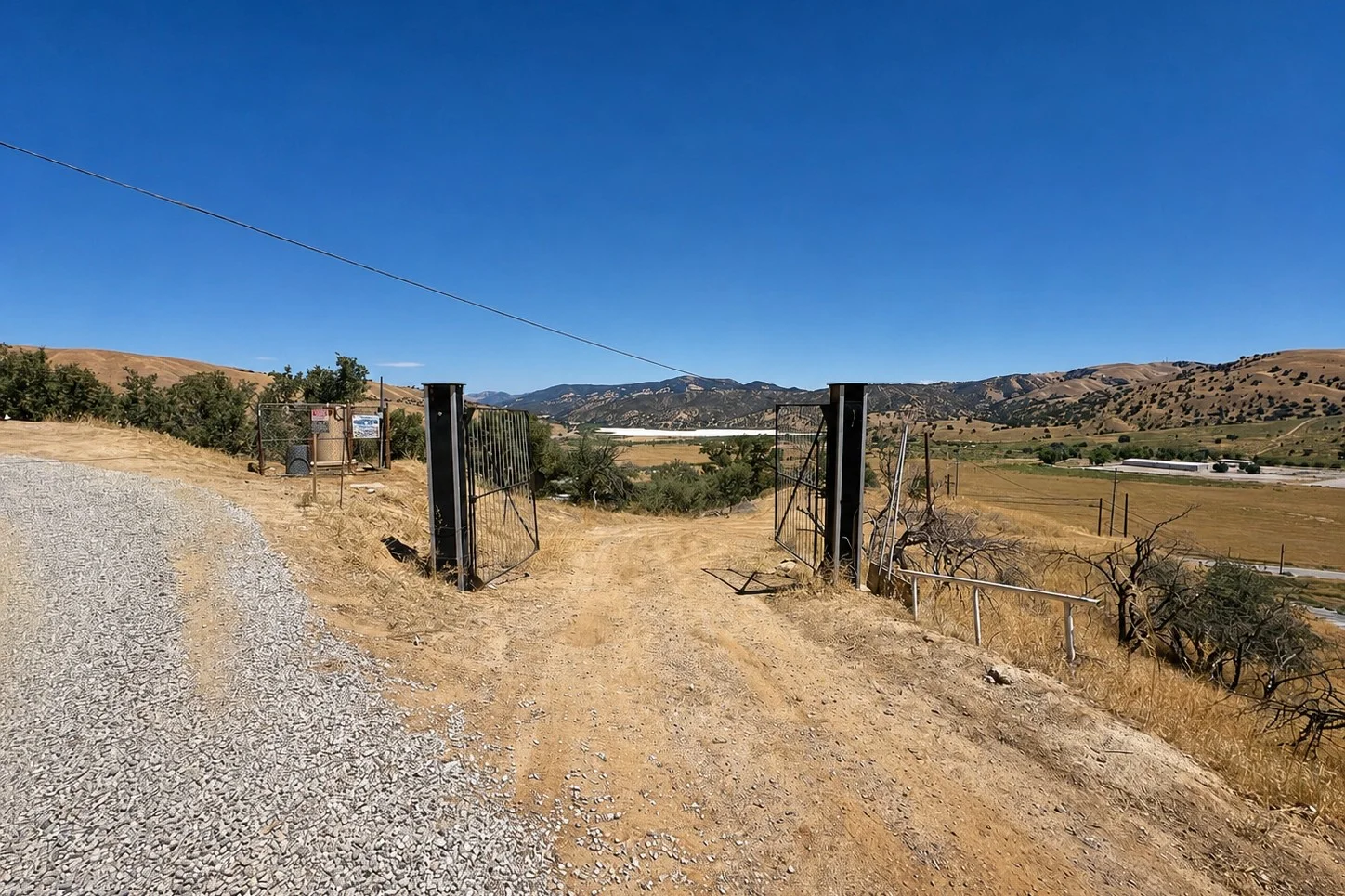 Existing gated entrance to the vacant land at 1588 Ridge Route Drive