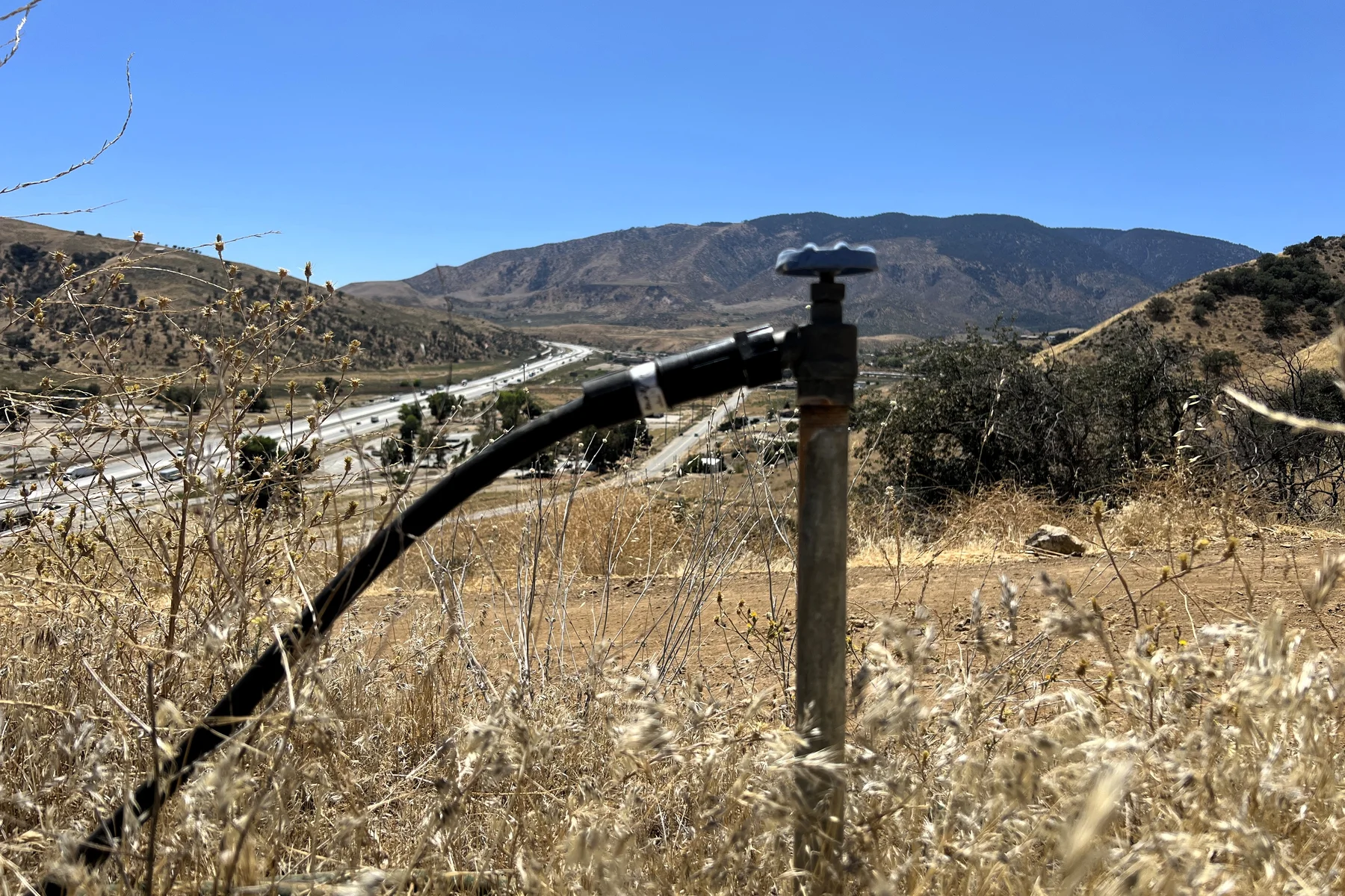 Existing water-line fixture on the Ridge Route acreage with the Lebec valley beyond