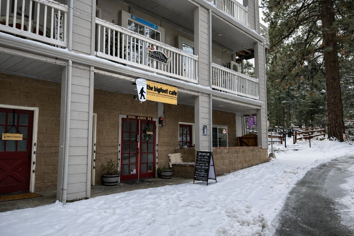 The Bigfoot Cafe entrance on Pine Valley Lane with fresh snow in Pine Mountain Club