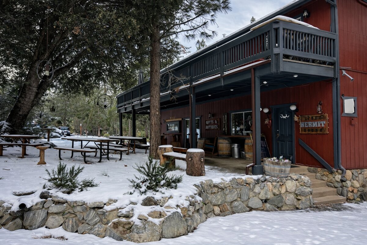 The Hermit House gifts and antiques shop with snow-covered patio in PMC Village