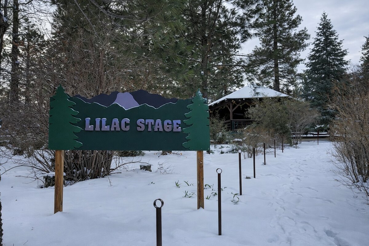 Lilac Stage sign with snow-covered gazebo in Pine Mountain Club Village