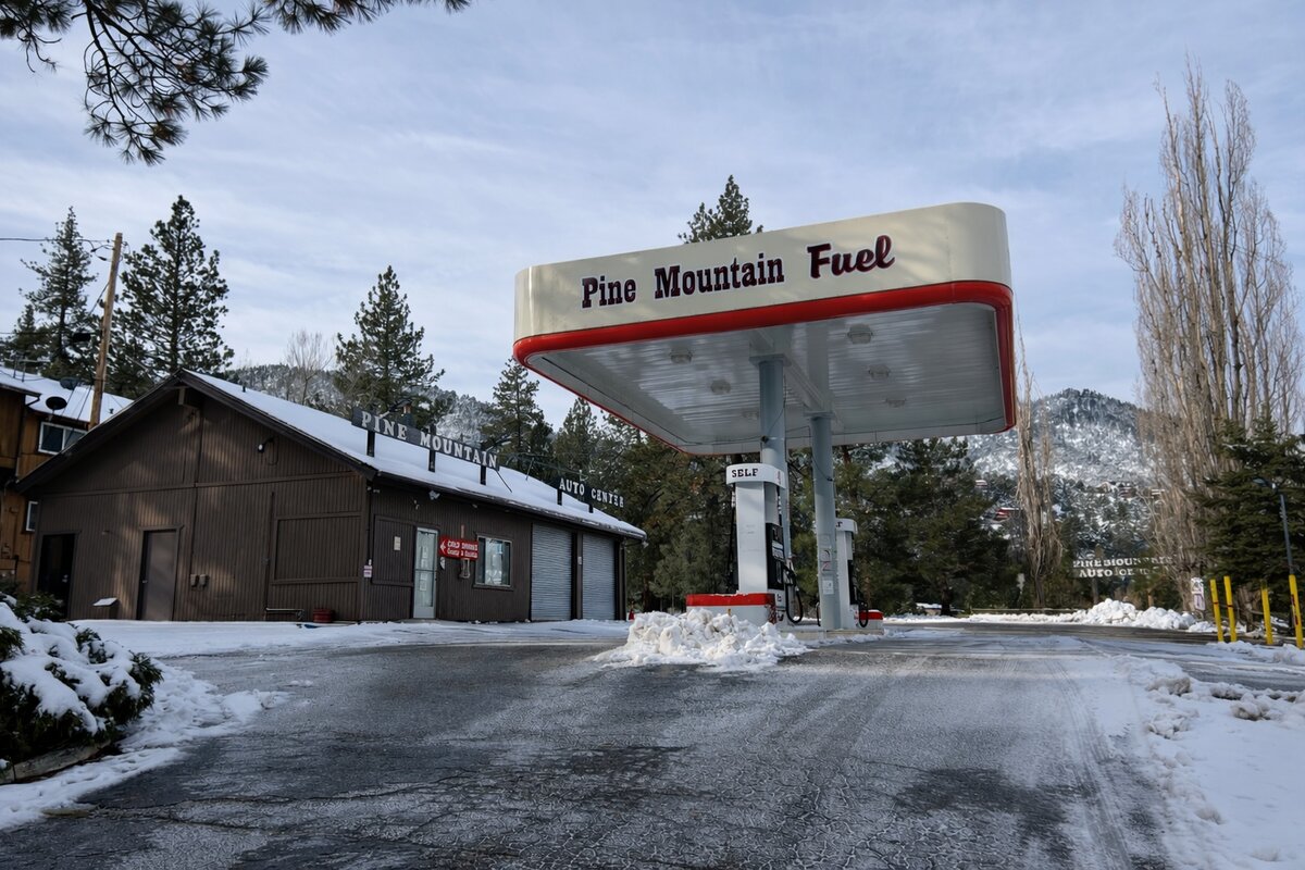 Pine Mountain Fuel gas station with snowy mountains in background
