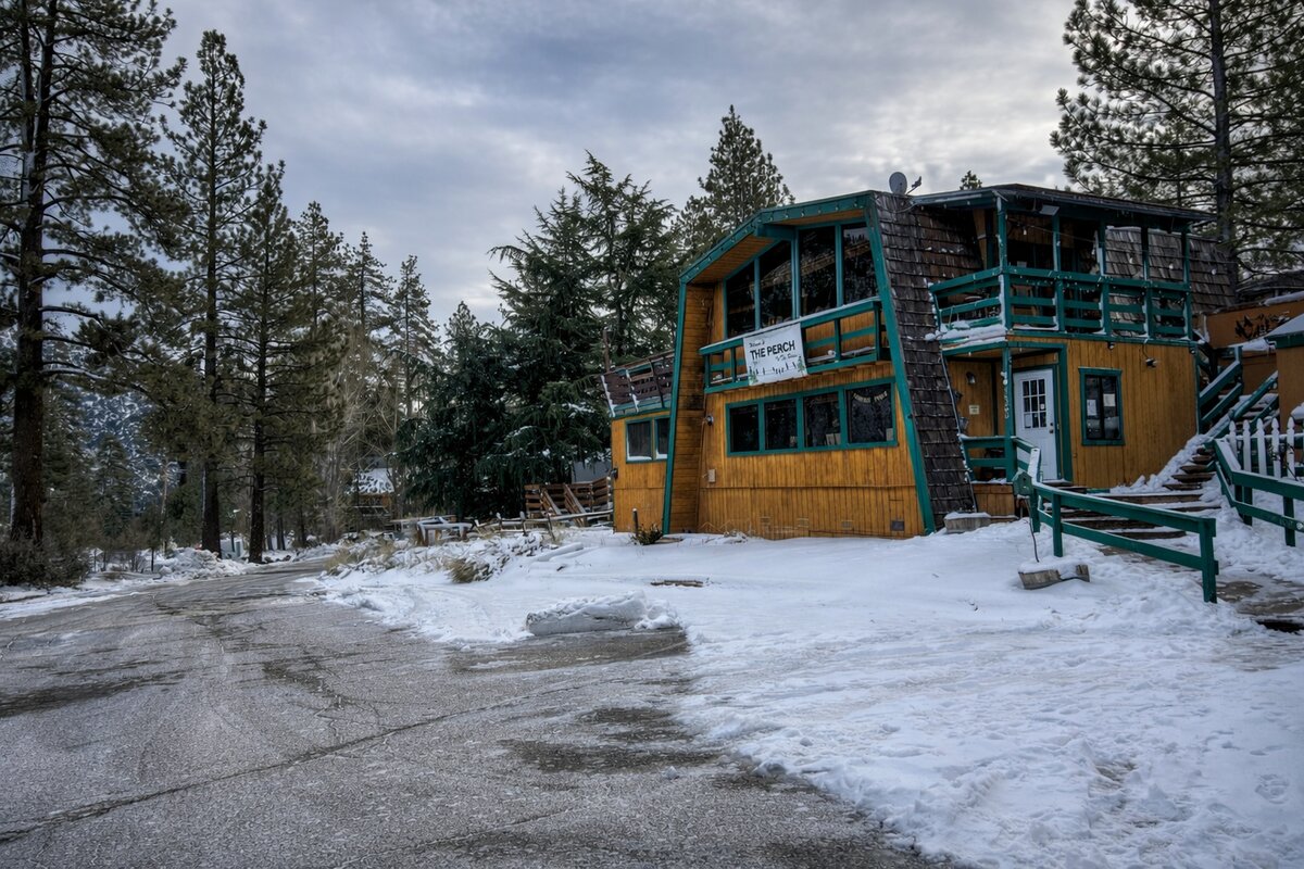 The Perch public house with snow-covered entrance in Pine Mountain Club